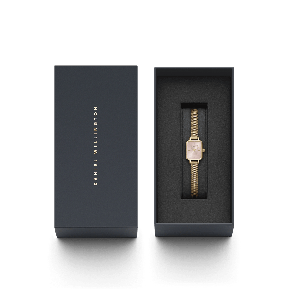 Quadro Mini Evergold Blush women’s watch with a blush pink rectangular dial and gold mesh strap, elegantly presented in a sleek Daniel Wellington gift box.
