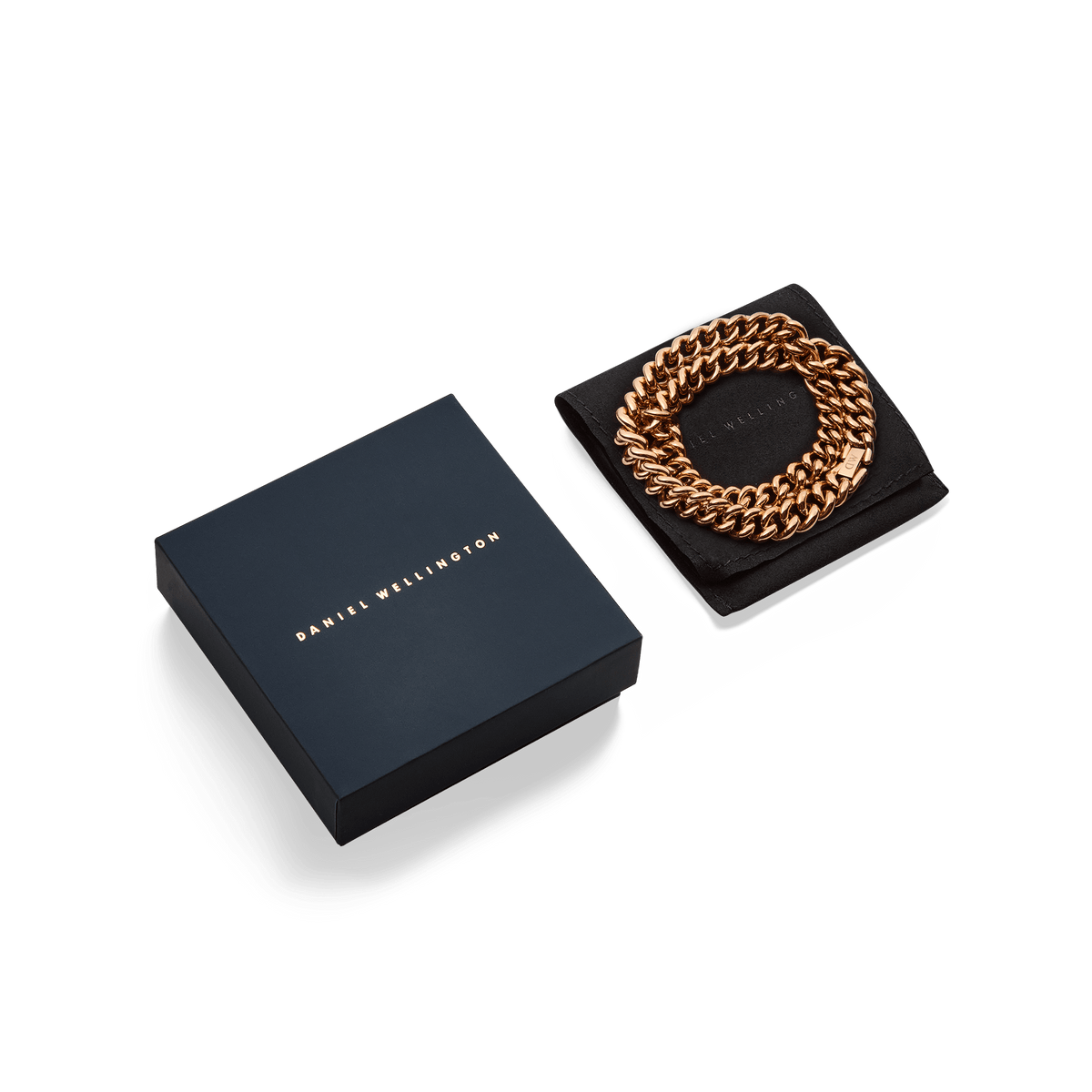 Chunky Chain Necklace Rose Gold displayed coiled on a black jewellery cushion next to a navy Daniel Wellington gift box, highlighting its polished curb links and elegant presentation.