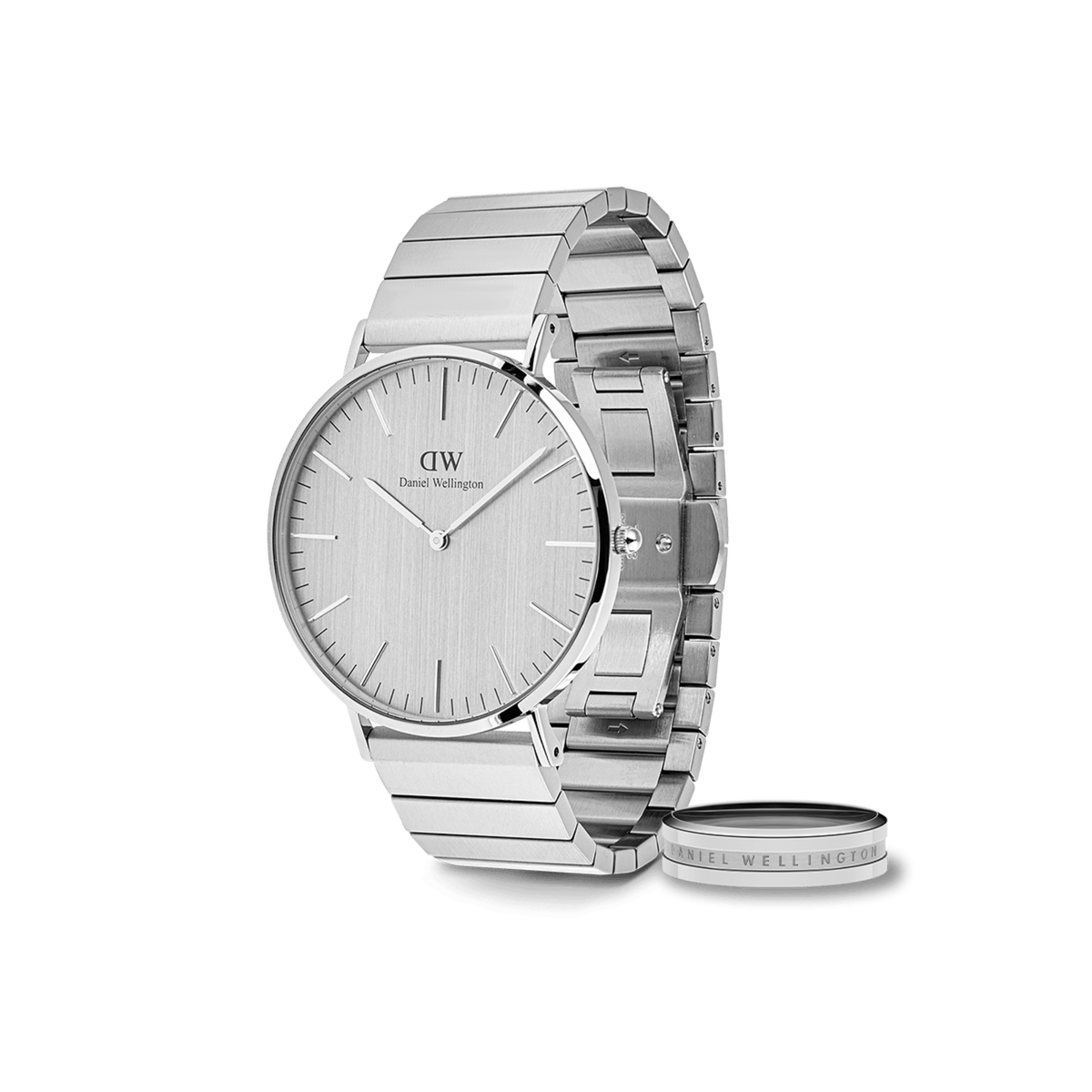 Sleek silver Daniel Wellington watch with a minimalist round dial and brushed steel link strap, paired with a matching engraved silver ring, both featuring a modern classic design.
