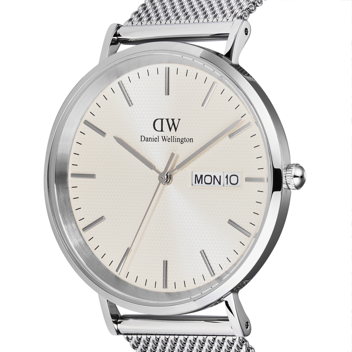 Close-up of the Classic Day Display Sterling Champagne watch, highlighting the champagne dial with subtle triangle pattern, day and date window, and polished silver stainless steel case with a mesh strap.