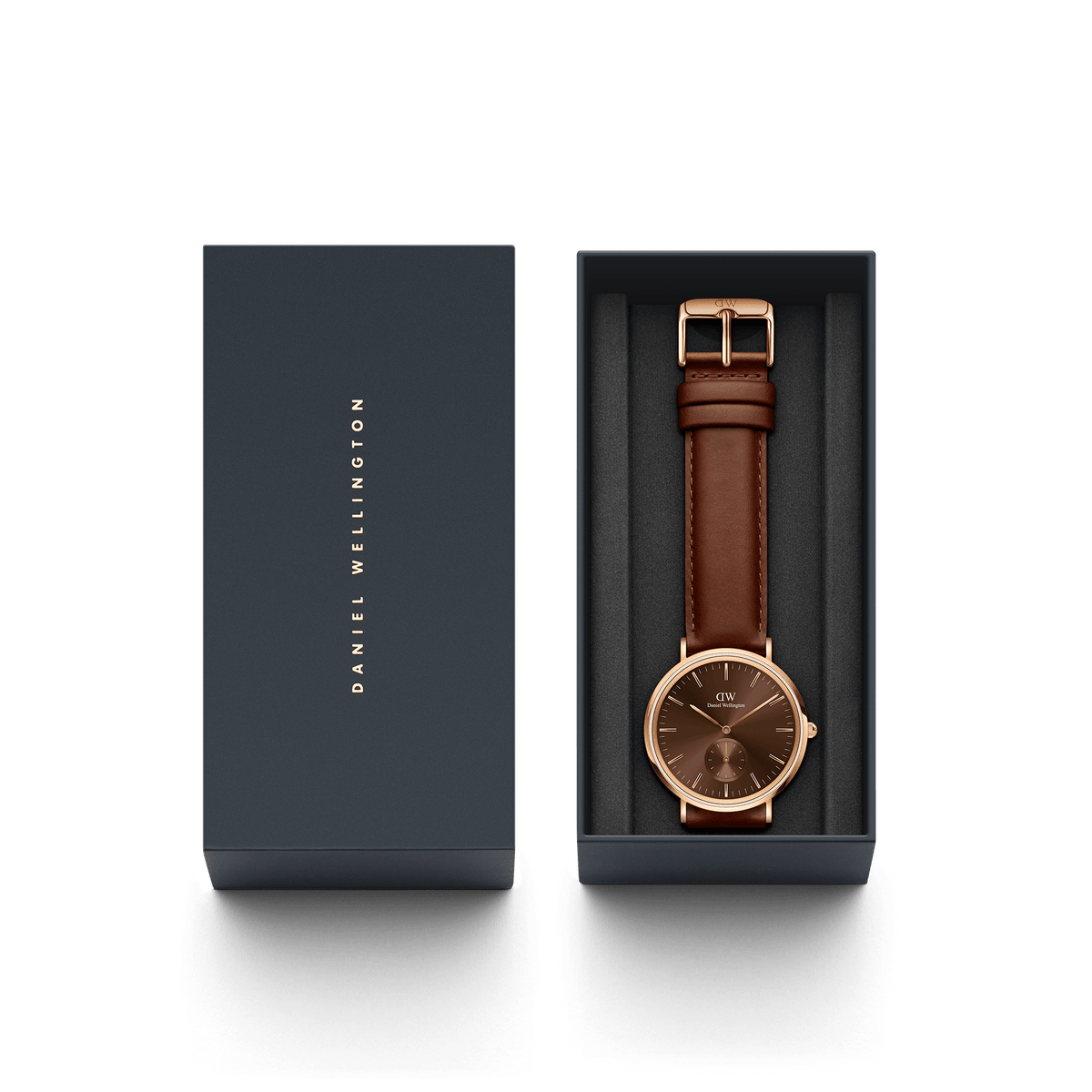 Classic Multi-Eye St Mawes Amber Rose Gold watch with an amber dial and brown leather strap, elegantly presented in a dark Daniel Wellington gift box.