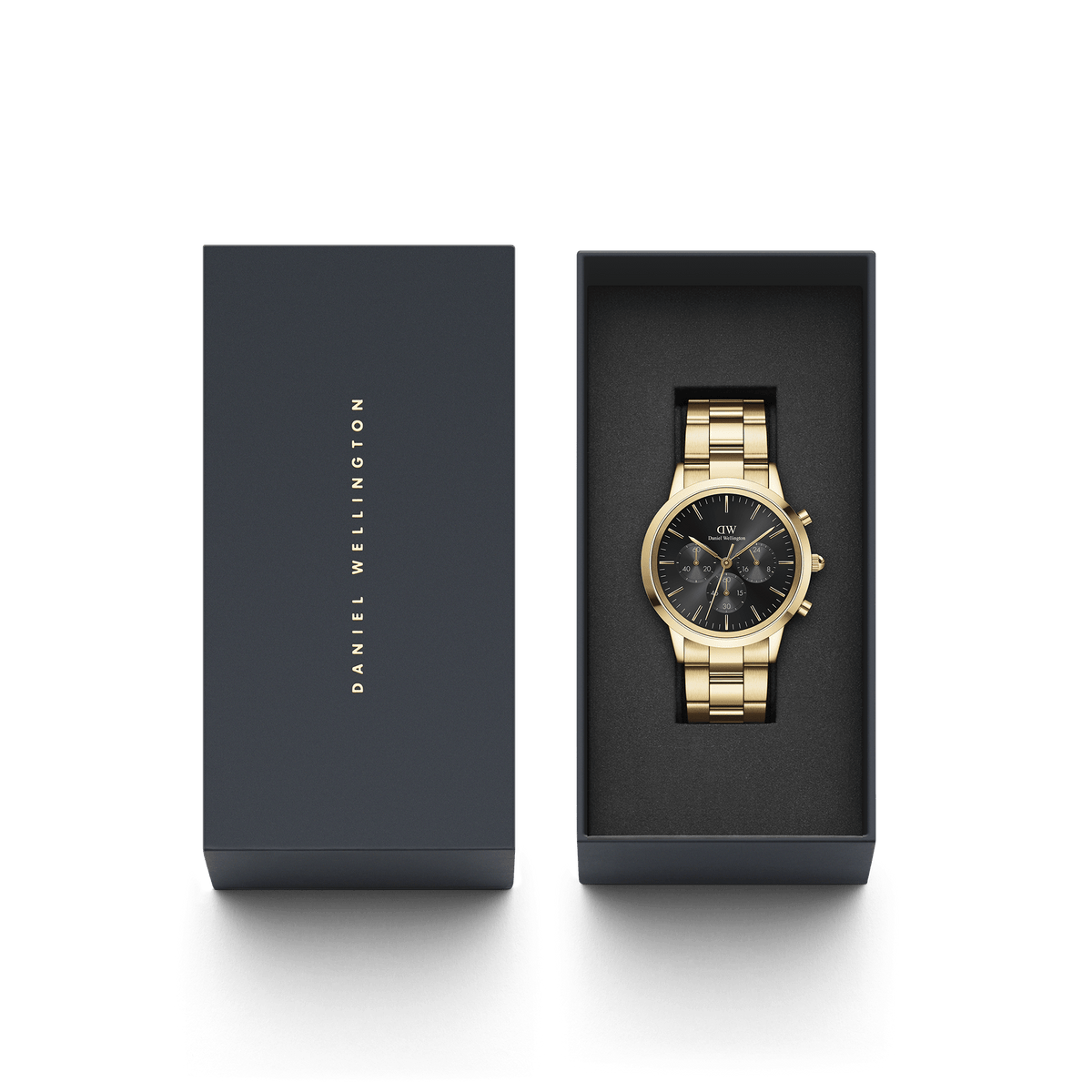 The Iconic Chronograph Link Onyx G gold watch with a black sunray dial is presented in an elegant Daniel Wellington gift box, highlighting its polished gold link bracelet and sophisticated design.