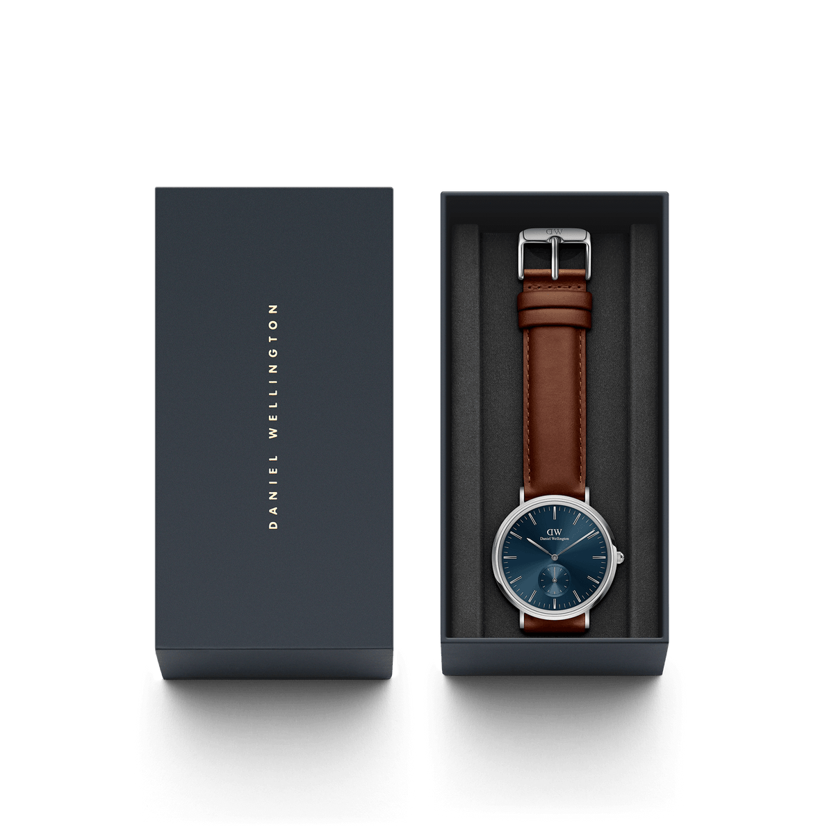 Classic Multi-Eye St Mawes Arctic Silver watch with a blue dial and brown leather strap, elegantly presented in a dark Daniel Wellington gift box.