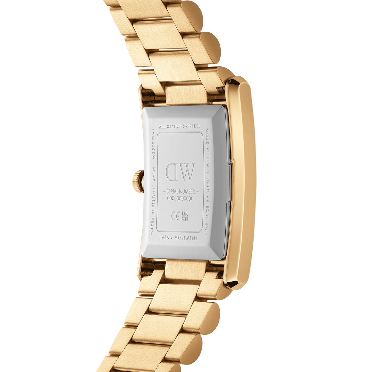Close-up of the Bound 3-Link Gold watch showing the stainless steel case back with engraved details and the polished gold three-link bracelet.