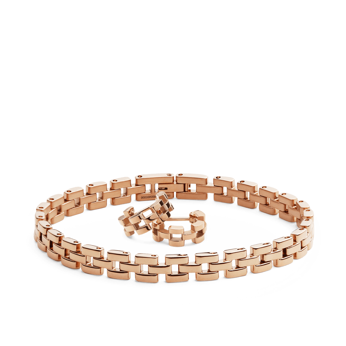 Polished rose gold jewellery set featuring a bold link bracelet and matching chunky link earrings, both crafted with a modern, sophisticated design.