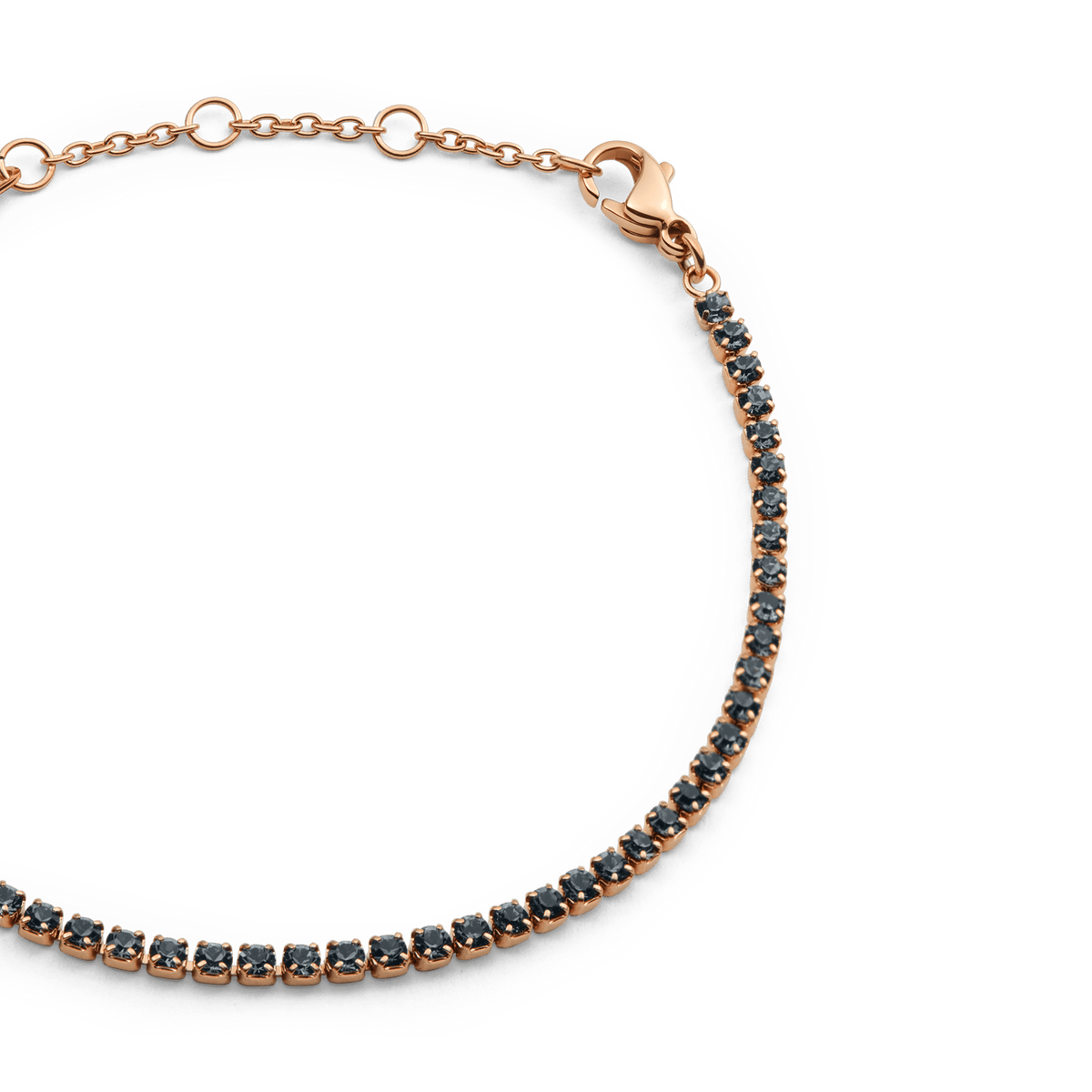 Close-up of the Classic Tennis Bracelet Nightfall Rose Gold, highlighting the adjustable rose gold chain with individually set midnight-toned Preciosa crystals and a secure lobster clasp.