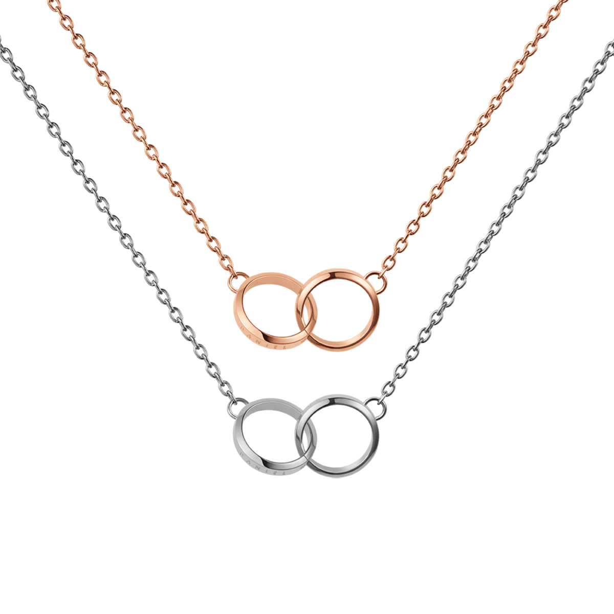 Two delicate necklaces featuring interlocking circle pendants, one in rose gold and the other in silver, displayed together to showcase their minimalist mixed metal design. The polished double rings and fine chains highlight the elegant and versatile style of the Elan Unity Necklace set.