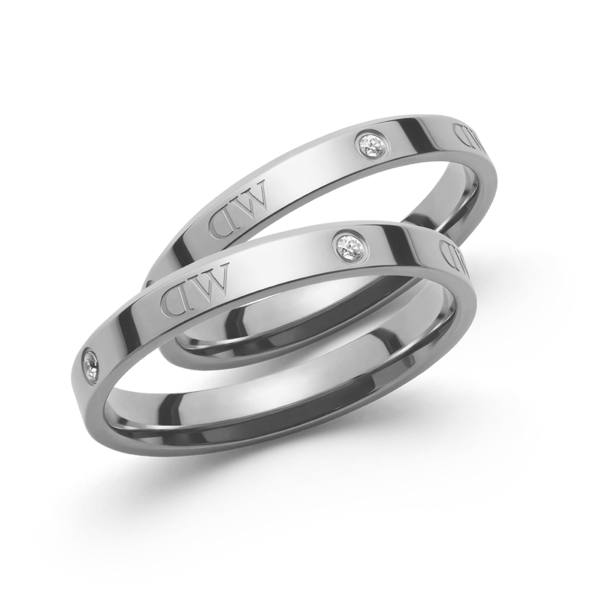 Pair of slim, polished silver-tone rings featuring subtle crystal accents and Daniel Wellington engraving, designed with a minimalist style for versatile, elegant wear.