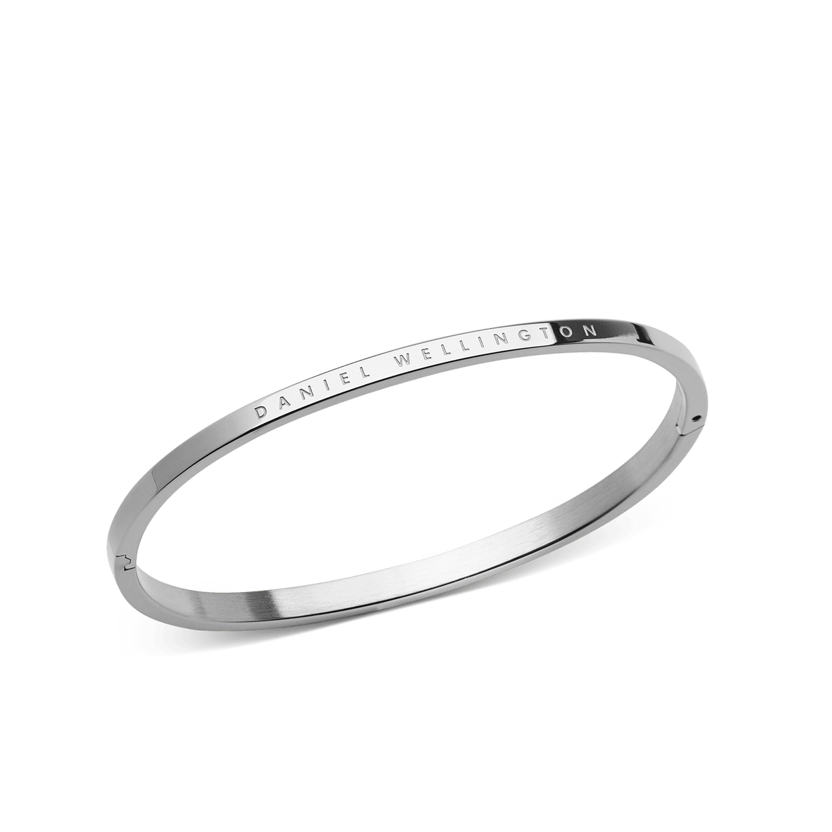 Classic Bangle Silver by Daniel Wellington, featuring a polished 316L stainless steel finish and subtle engraved branding, shown at an angle to highlight its minimalist, modern design.