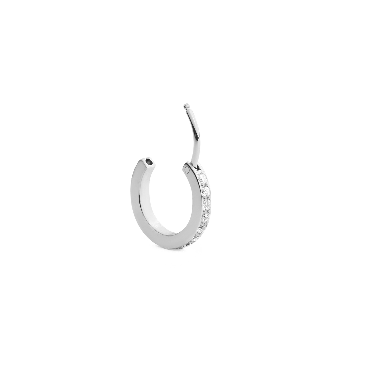 Crystal Hoop Earring Silver shown open, highlighting its polished silver finish and a row of sparkling cubic zirconia crystals in a modern claw setting.