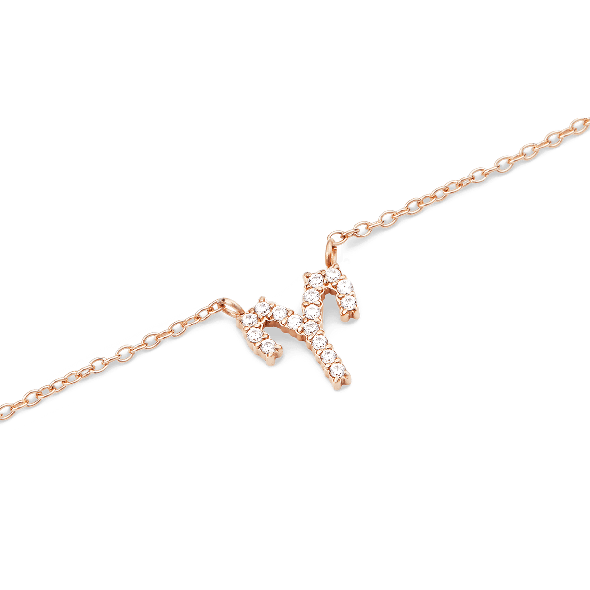 Close-up of a rose gold chain necklace with a sparkling Scorpio zodiac pendant set with hand-placed crystals.