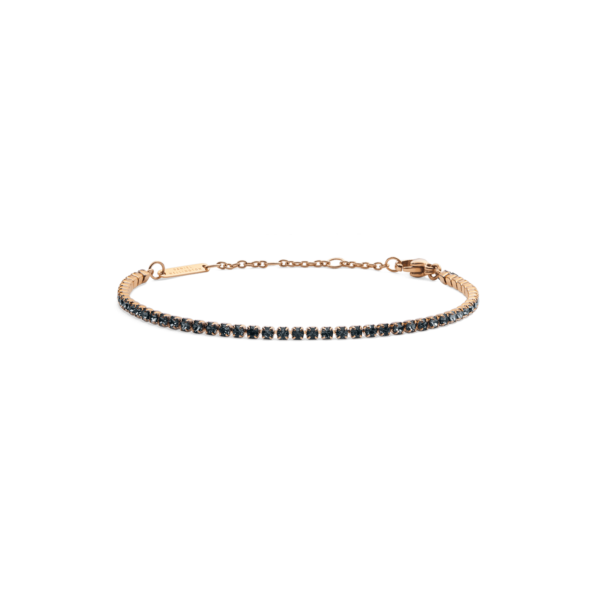 Slender rose gold tennis bracelet featuring a row of deep midnight-toned Preciosa crystals, set on an adjustable chain with a secure lobster clasp.