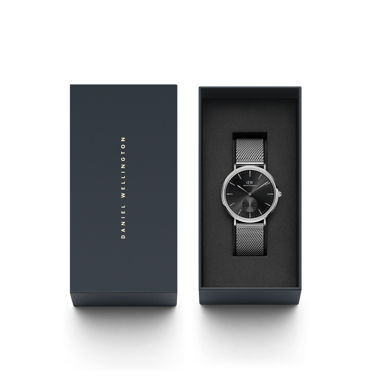 Classic Multi-Eye Sterling Onyx men’s watch with a black dial and silver mesh strap, elegantly presented in a dark Daniel Wellington gift box.