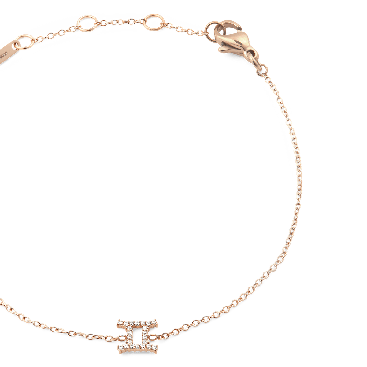 Rose gold chain bracelet featuring a delicate Gemini zodiac pendant adorned with sparkling crystals and an adjustable clasp.