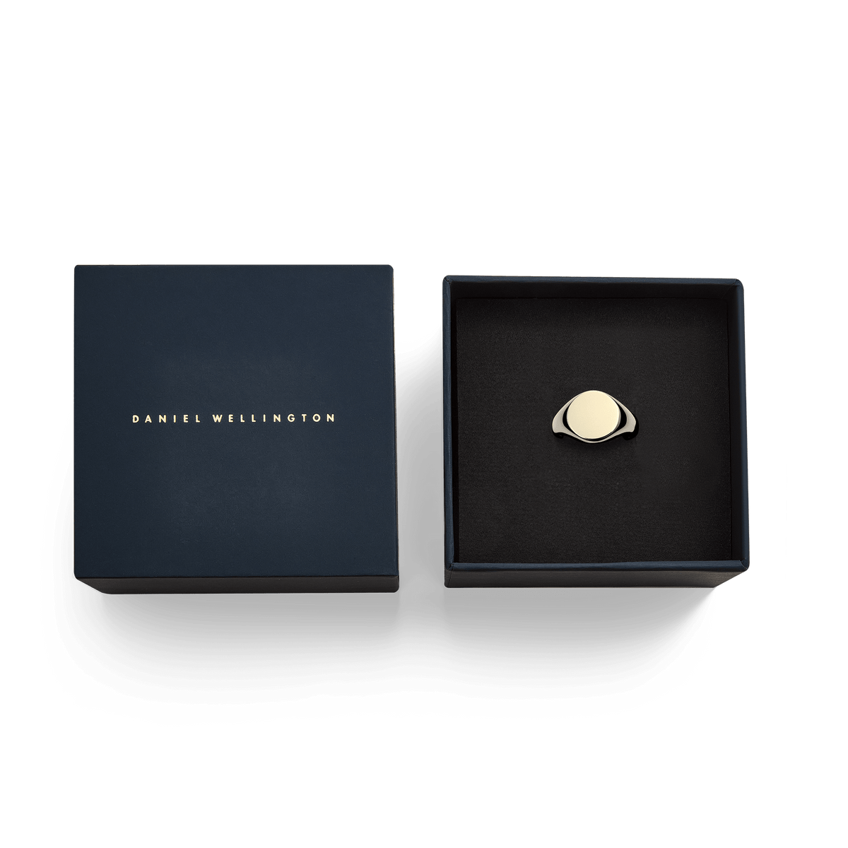 Gold classic signet ring in a navy Daniel Wellington gift box, featuring a polished, engraveable flat face and elegant design.