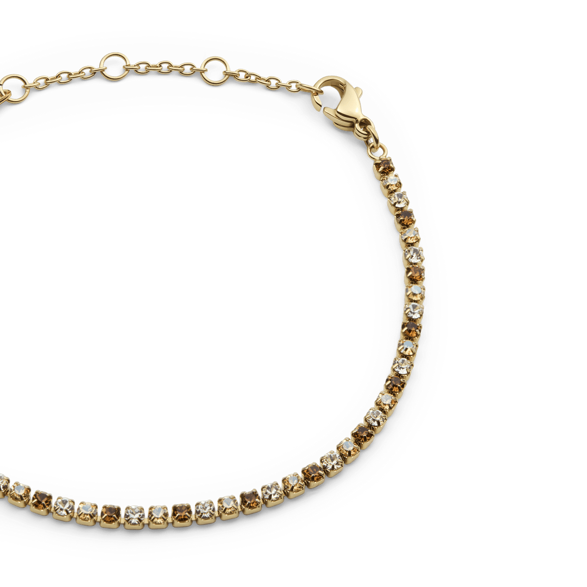 Classic Tennis Bracelet Honey Combo Gold featuring a slim gold chain with a row of honey-toned and clear Preciosa crystals, finished with an adjustable lobster clasp.