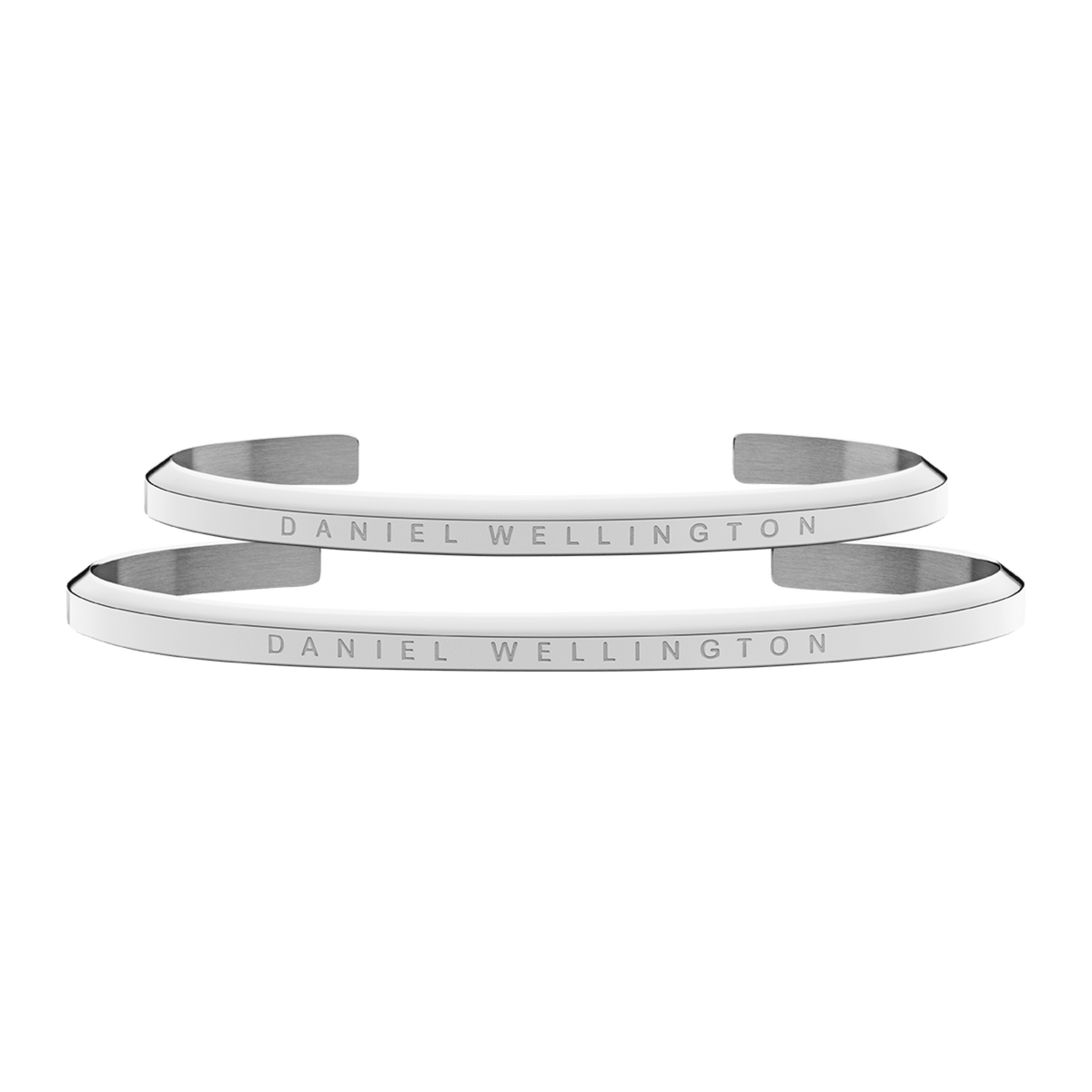Pair of Daniel Wellington classic silver open bangle bracelets, each crafted from polished stainless steel and engraved with the brand’s signature logo.
