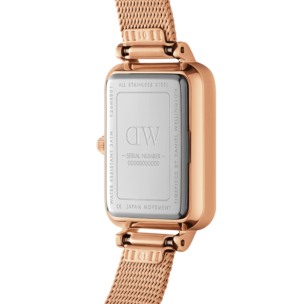 Close-up of the Quadro Lumine Bezel Melrose Pink MOP watch case back, showing the stainless steel backplate, engraved branding, and rose gold mesh strap.