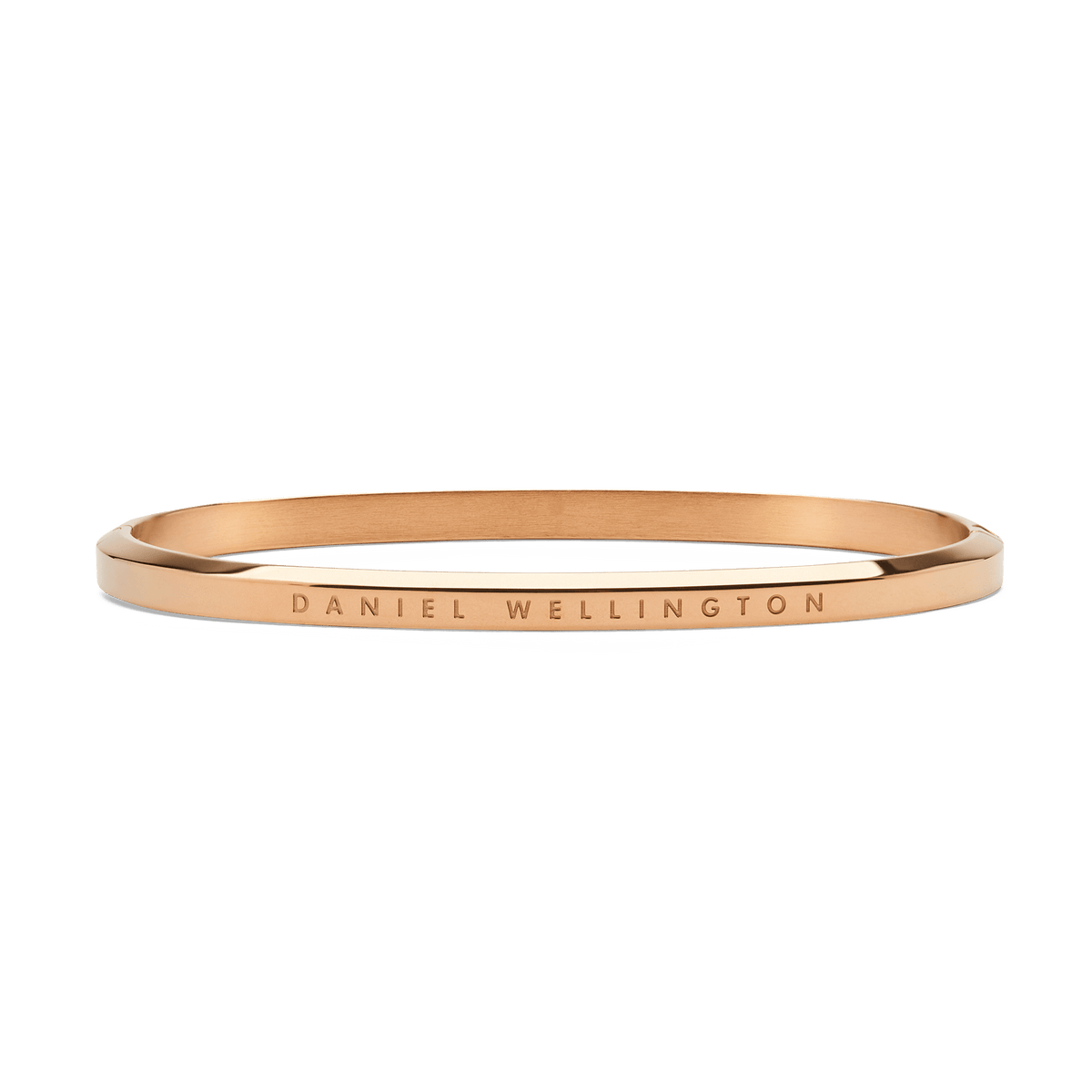 Slim rose gold bangle crafted from polished stainless steel, featuring a minimalist design with subtle Daniel Wellington engraving along the outer edge.