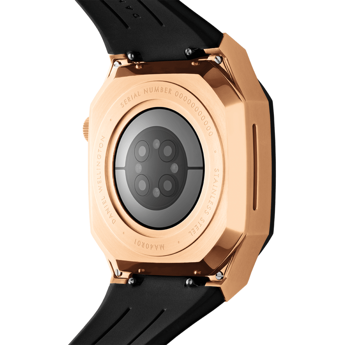Close-up of the Switch Rose Gold Apple Watch case showing the brushed rose gold stainless steel back, engraved detailing, and black synthetic rubber strap.