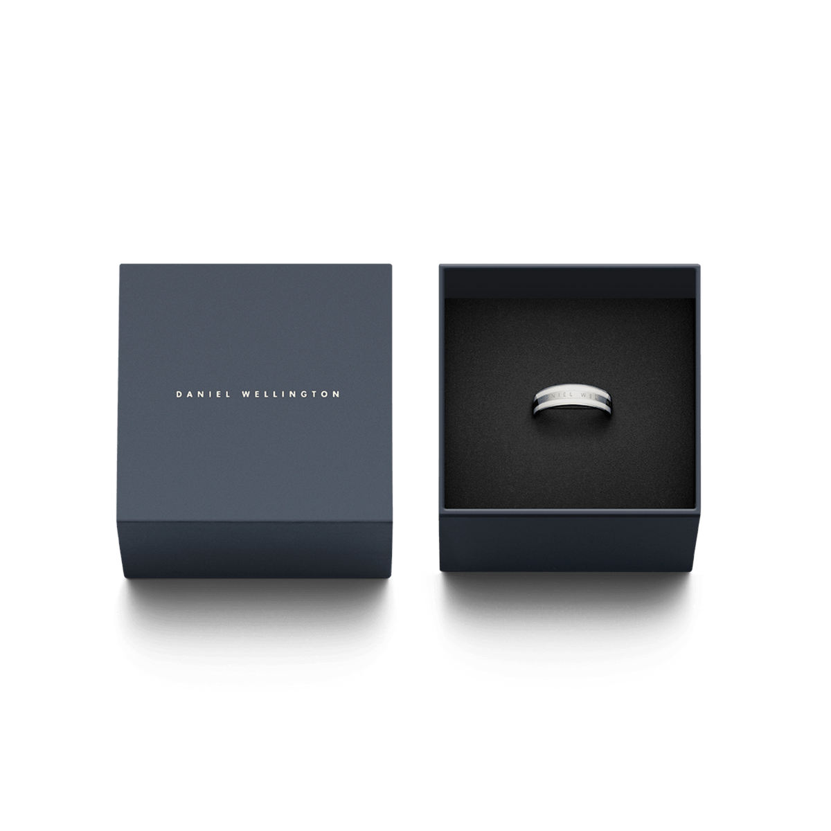 Emalie Ring Silver presented in an elegant Daniel Wellington gift box, showcasing its polished silver band with a satin white enamel inlay.