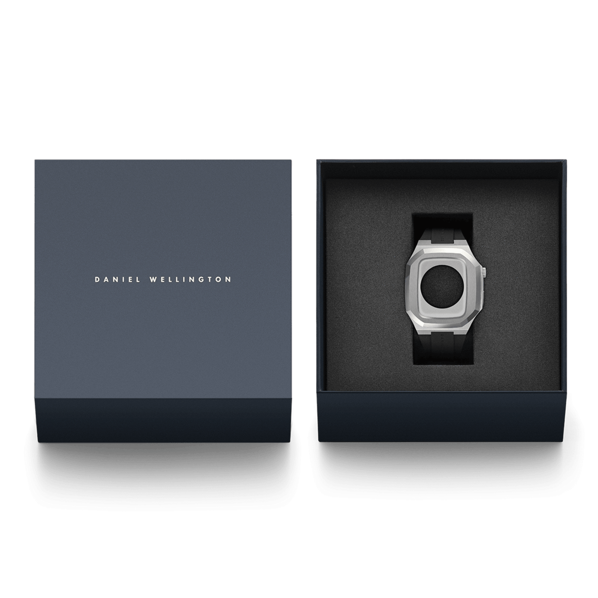 Daniel Wellington Switch Silver Apple Watch case with black rubber strap, presented in an elegant navy gift box with branded lid.