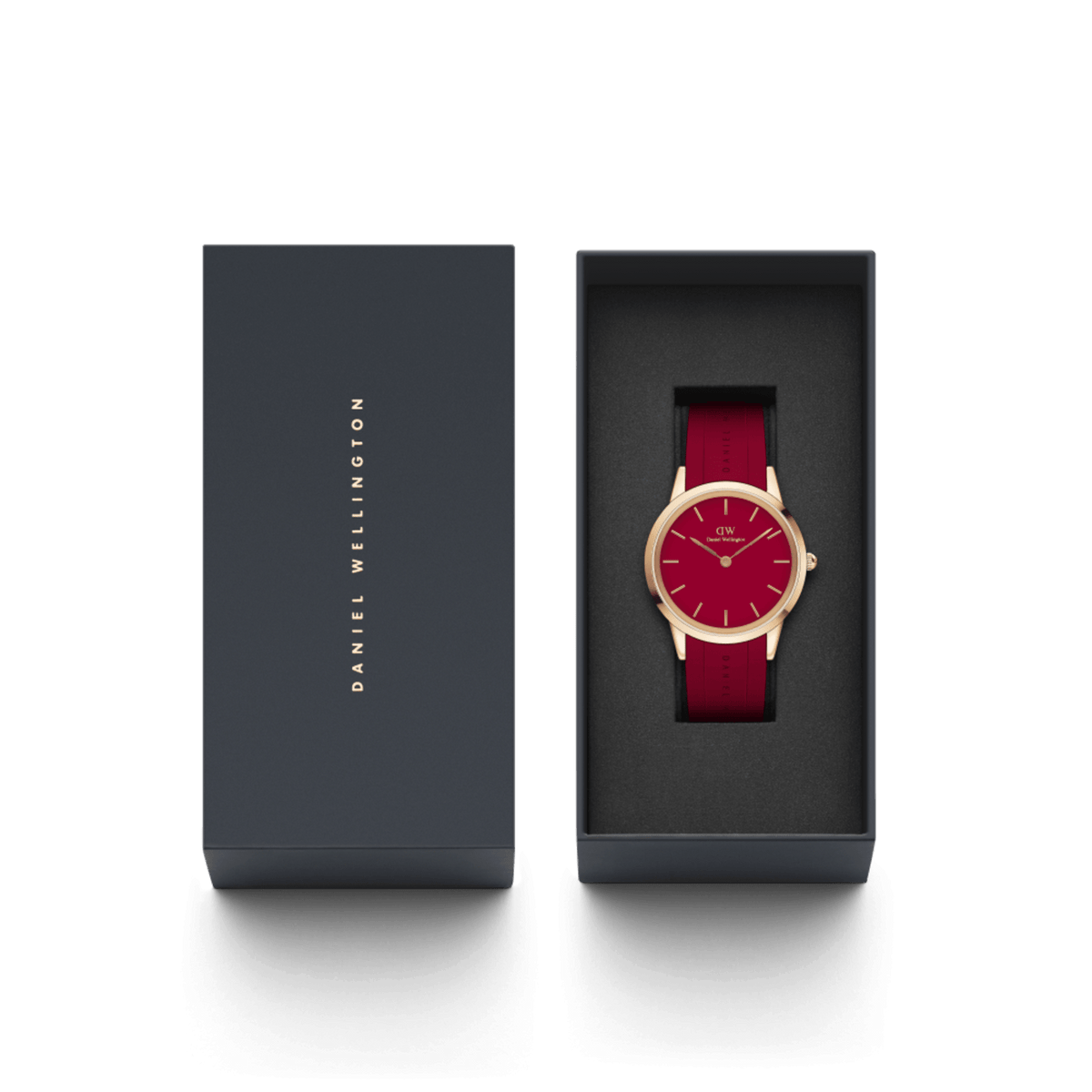 Daniel Wellington Iconic Motion Ruby watch with a rose gold case and red rubber strap, presented in an elegant branded gift box.