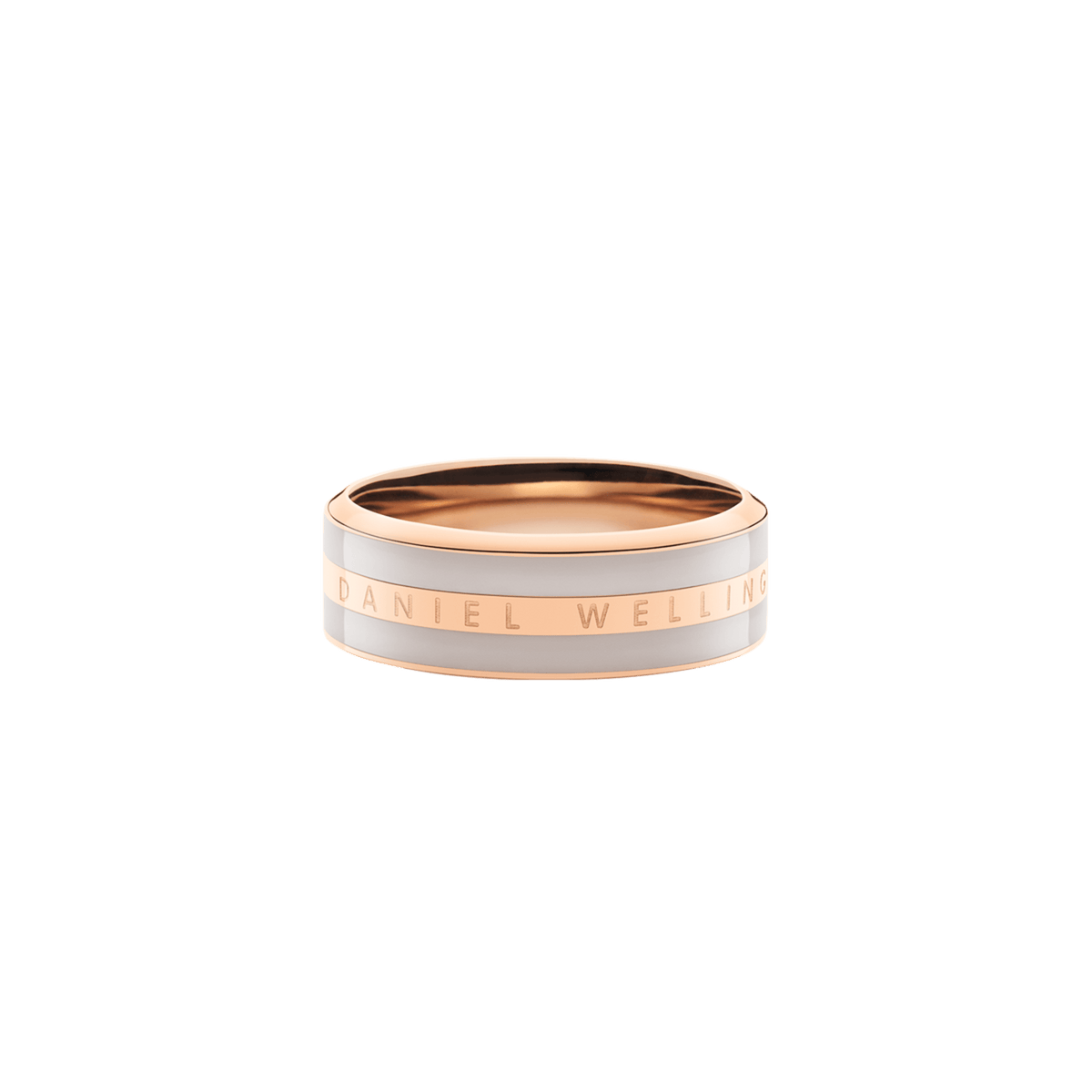 Wide rose gold band ring with a desert sand enamel inlay and Daniel Wellington engraved along the polished edge.