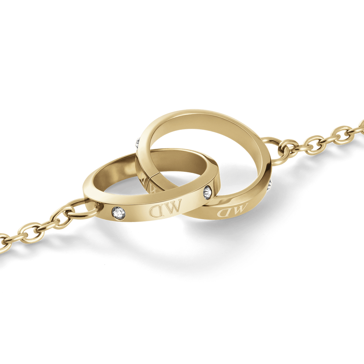 Close-up of the Classic Lumine Unity Gold necklace showing two interlocking polished gold circles with engraved initials and sparkling crystal accents on a fine chain.