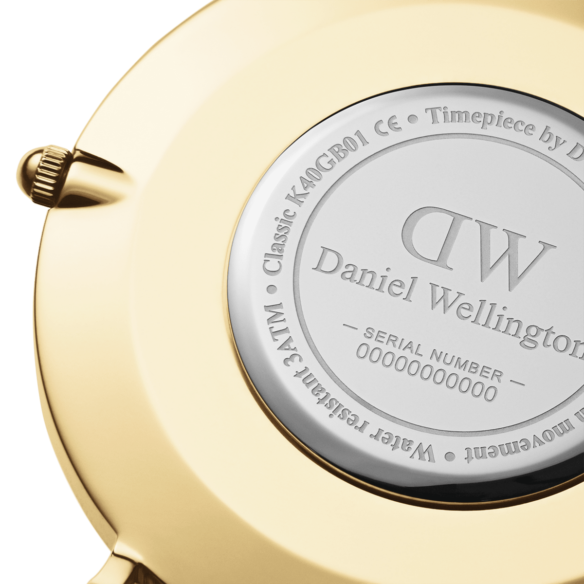Close-up of the Daniel Wellington Classic Sheffield watch case back, showing engraved branding, model details, and gold-plated finish.