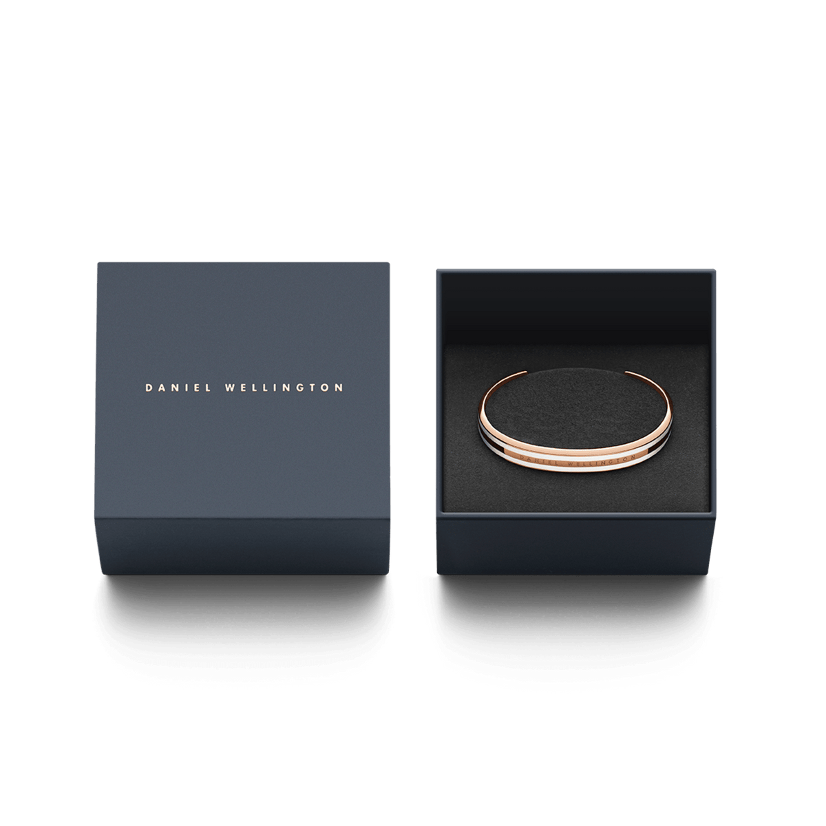 Emalie Slim Bracelet in rose gold with a satin white enamel inlay, elegantly presented in an open Daniel Wellington gift box.
