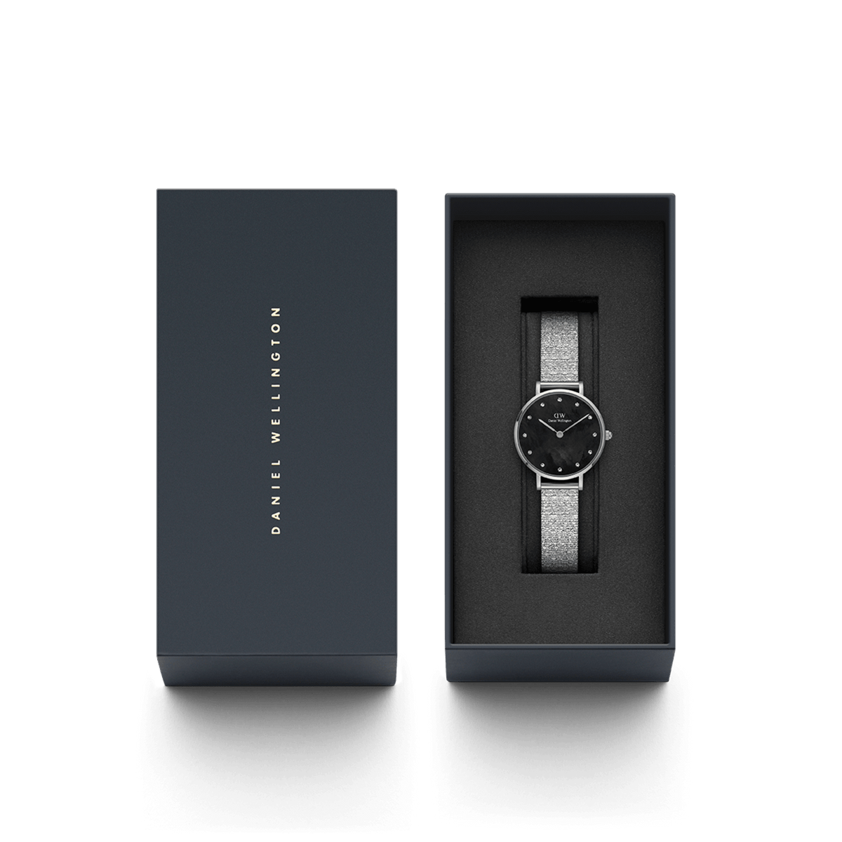 Petite Lumine Pressed Piano Silver women’s watch with black dial in Daniel Wellington gift box, elegant and ready to gift.