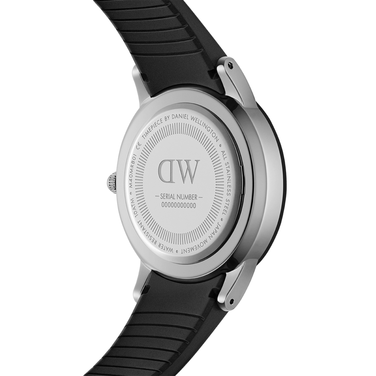 Close-up of the Daniel Wellington Iconic Motion watch showing the engraved stainless steel case back and black FKM rubber strap.