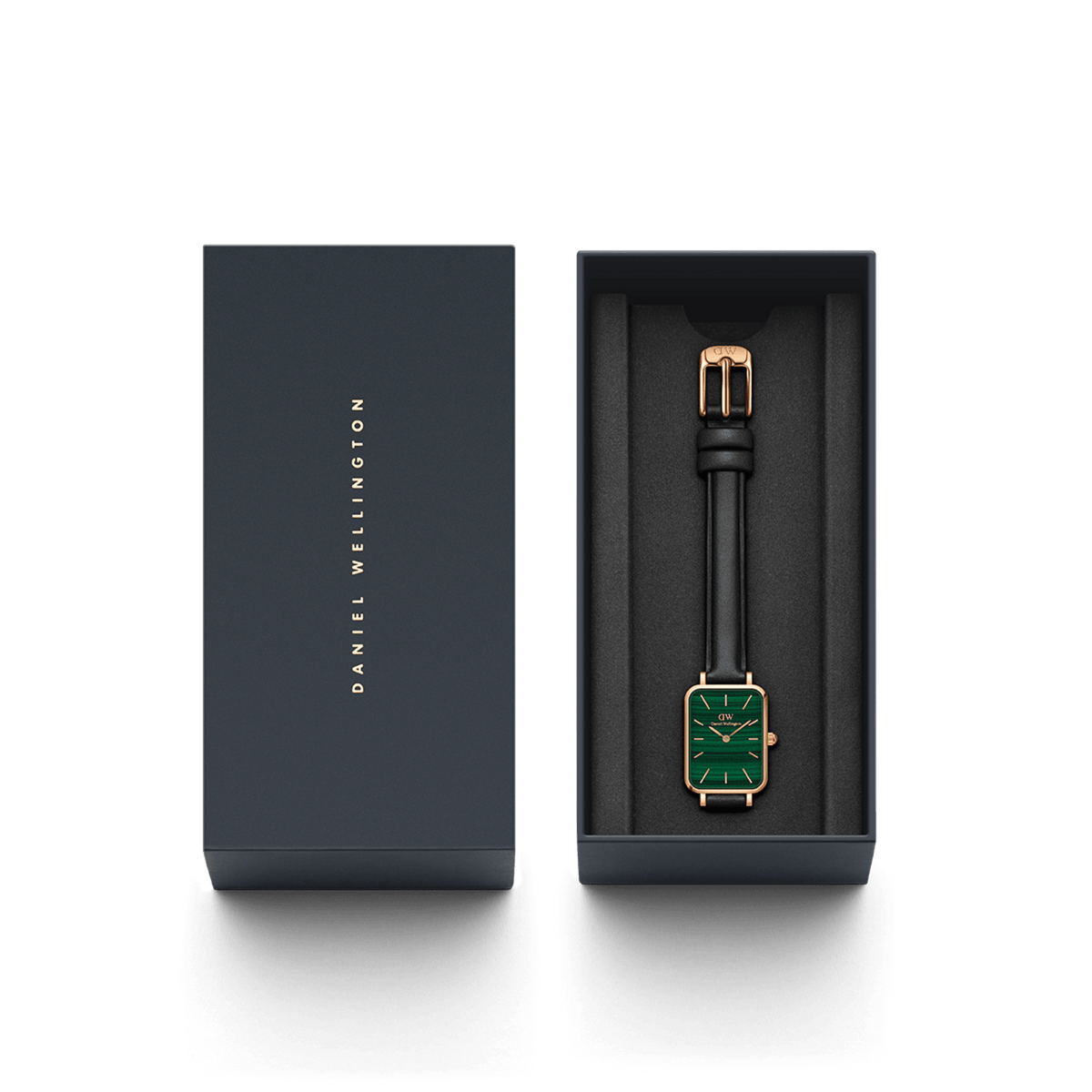 Quadro Pressed Sheffield Green Rose Gold watch with a green rectangular dial and black leather strap, elegantly presented in a dark Daniel Wellington gift box.