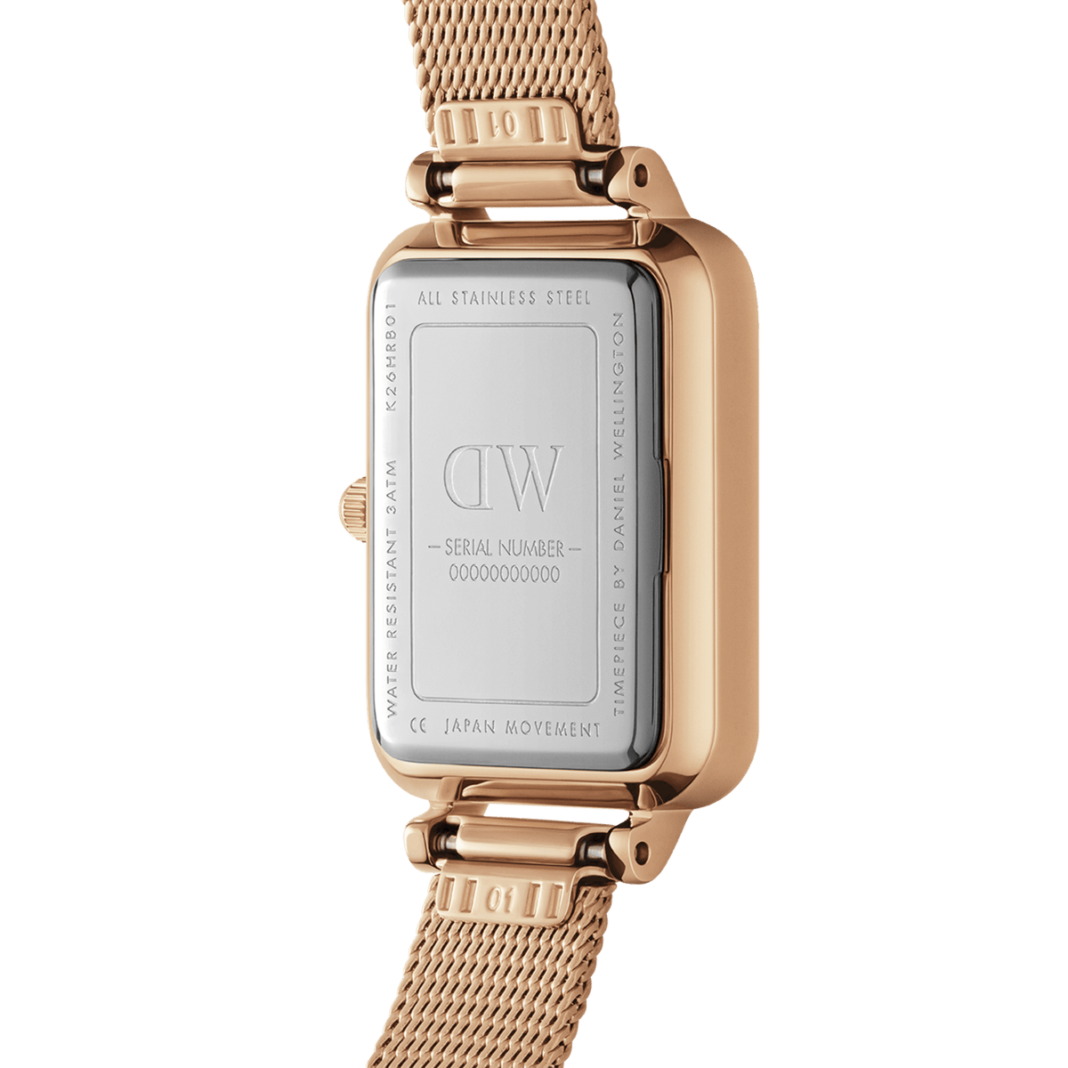 Close-up of the Quadro Pressed Melrose Pink MoP Rose Gold watch case back, showing stainless steel details, engraved branding, and the rose gold mesh strap.