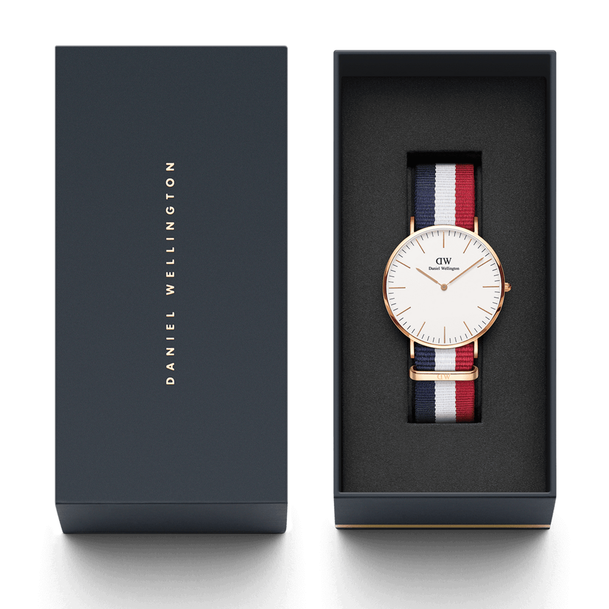 Classic Cambridge Rose Gold watch with a blue, white, and red NATO strap presented in an elegant Daniel Wellington gift box.