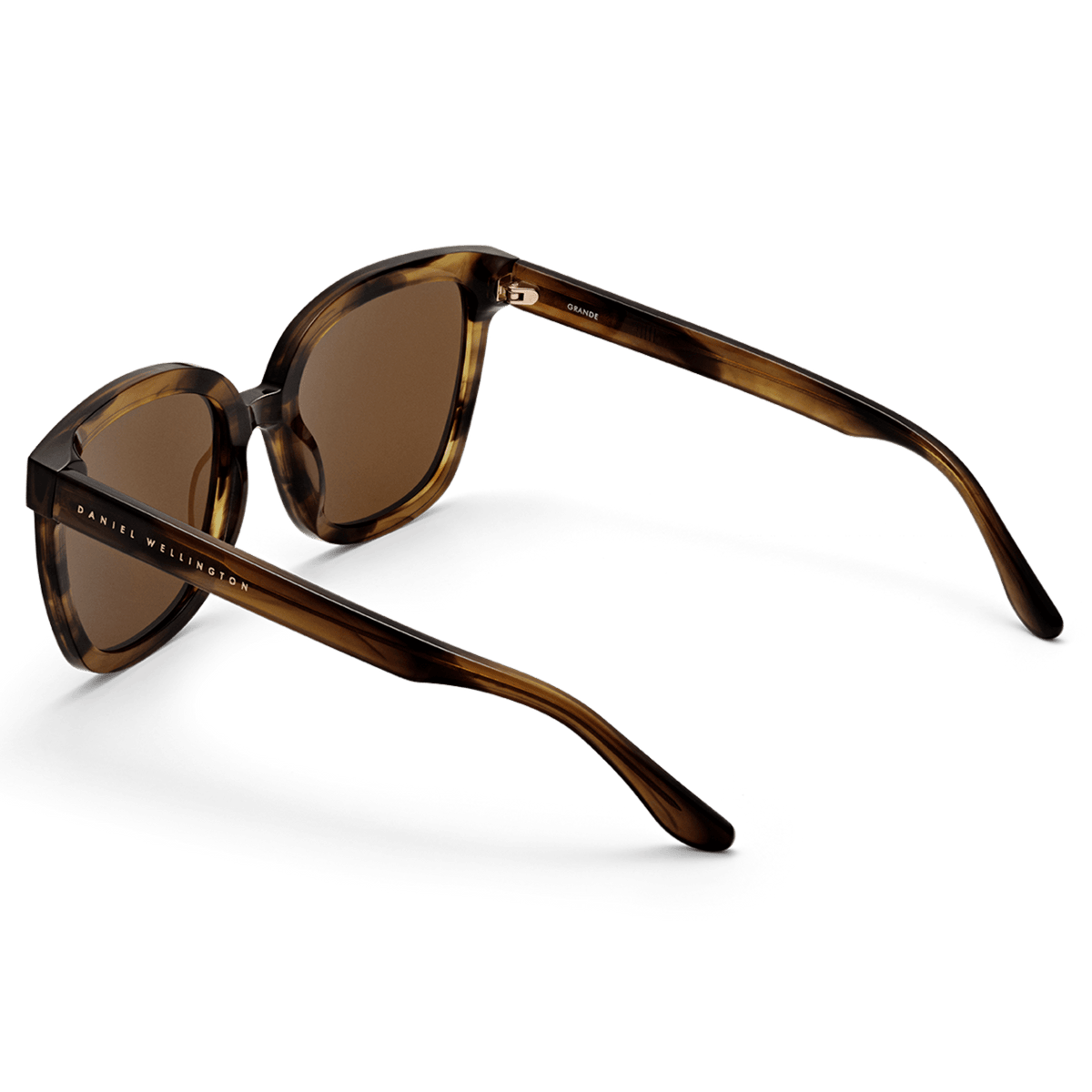 Grande Bio-Acetate Brown Demi sunglasses with a square tortoiseshell-style frame, amber lenses, and Daniel Wellington branding on the arms, shown from a rear angle.
