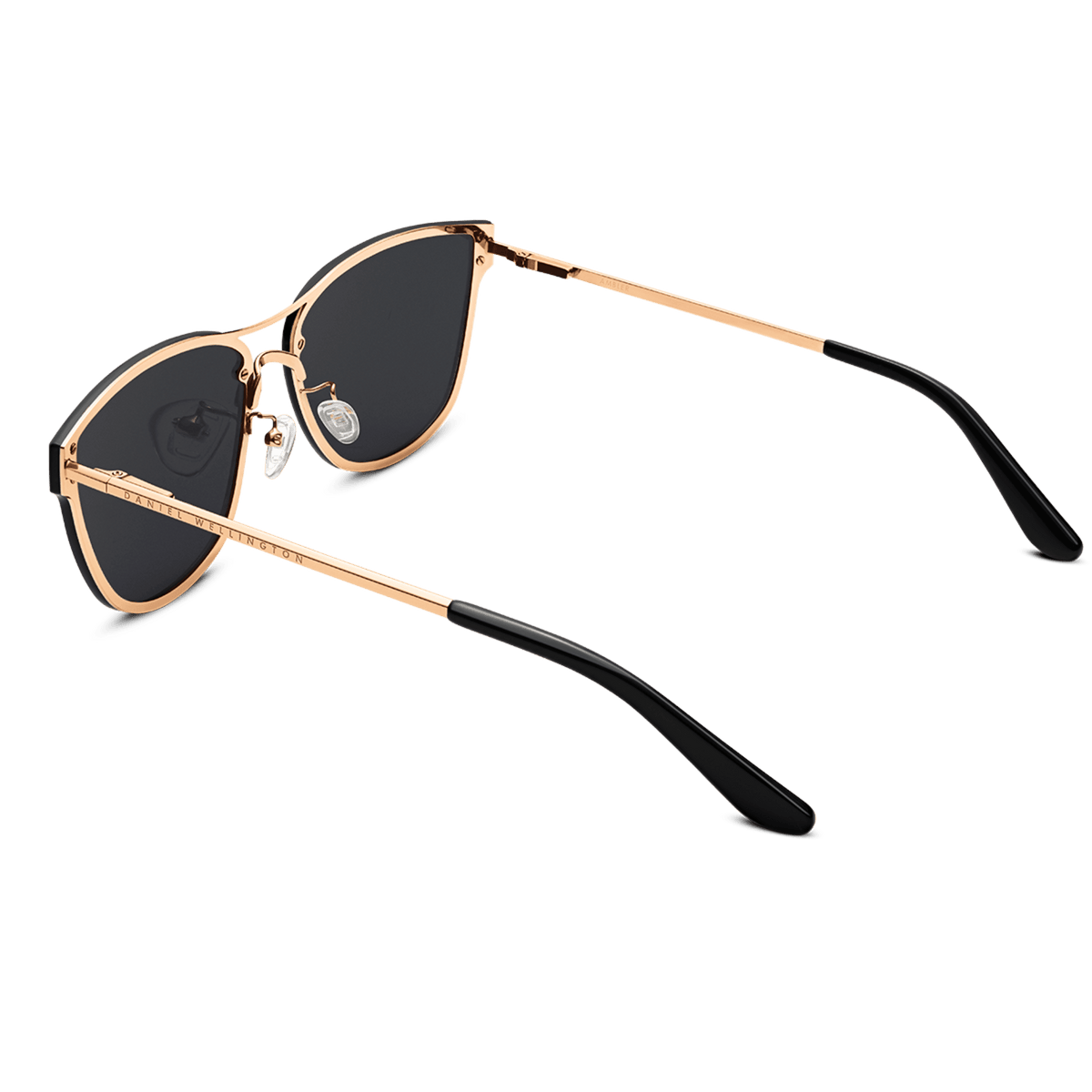 Ambler Steel Rose Gold sunglasses with rose gold plated stainless steel frames, black lenses, adjustable silicone nose pads, and black acetate temple tips, shown from a rear angle.