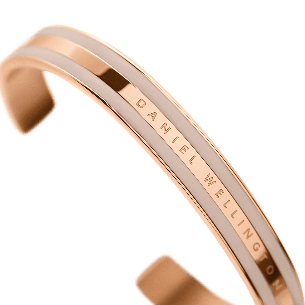 Close-up of the Daniel Wellington Emalie Bracelet Desert Sand Rose Gold, showing the rose gold finish, Desert Sand enamel detailing, and engraved branding on the open cuff.