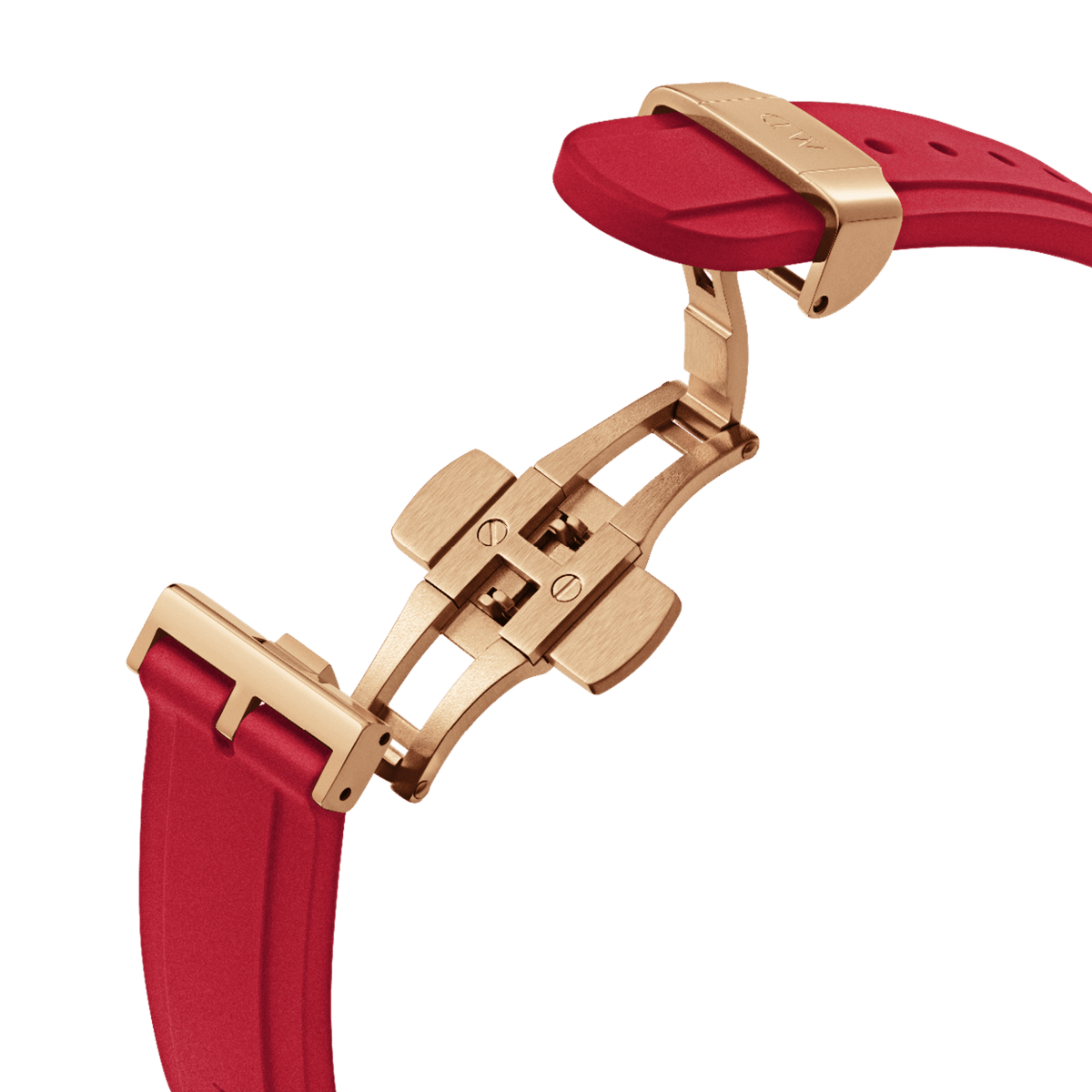 Detail of the Daniel Wellington Iconic Motion Ruby watch showing the ruby red FKM rubber strap with a secure rose gold deployment clasp.