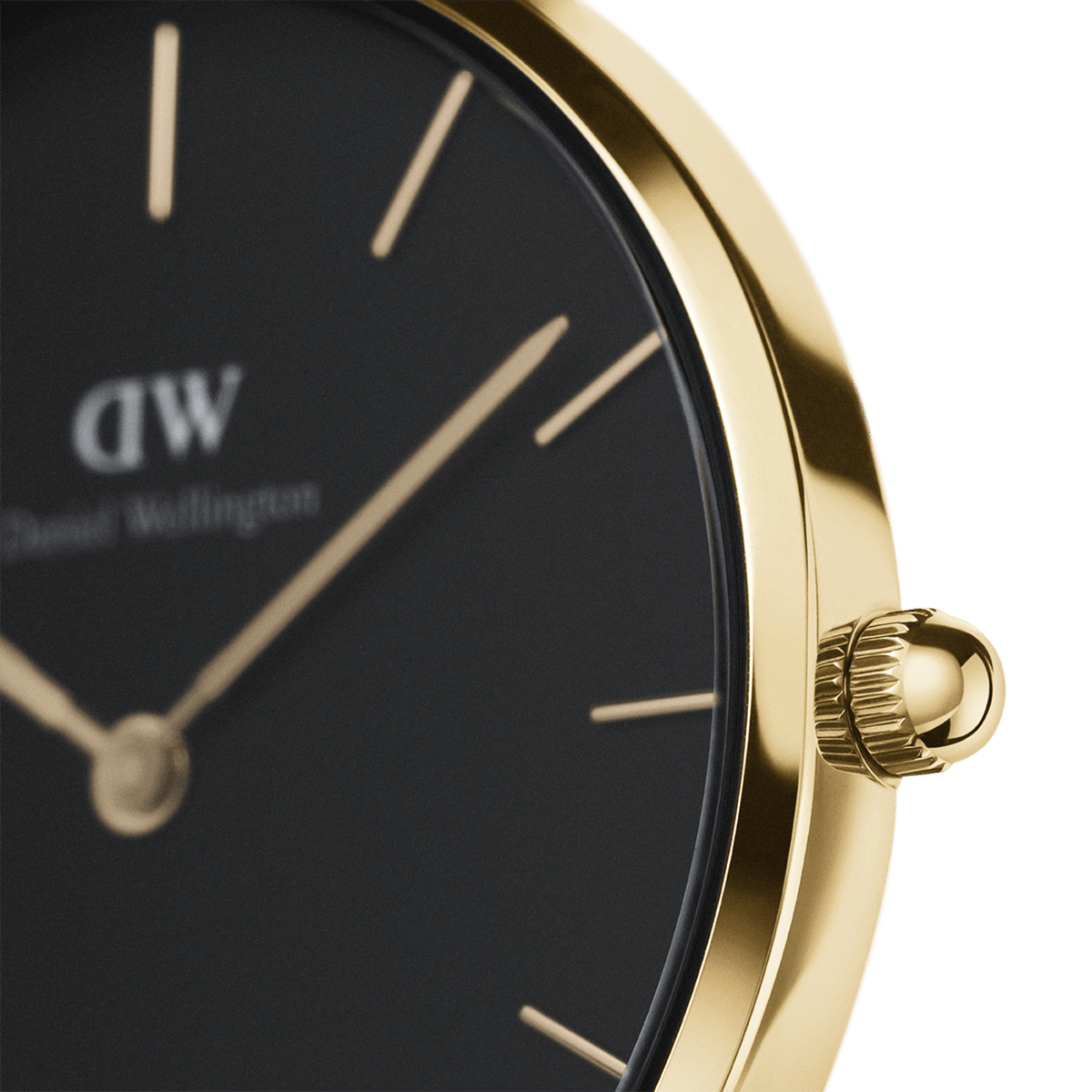 Close-up of Daniel Wellington Petite St Mawes Gold watch with black dial, gold case, and minimalist gold hour markers.