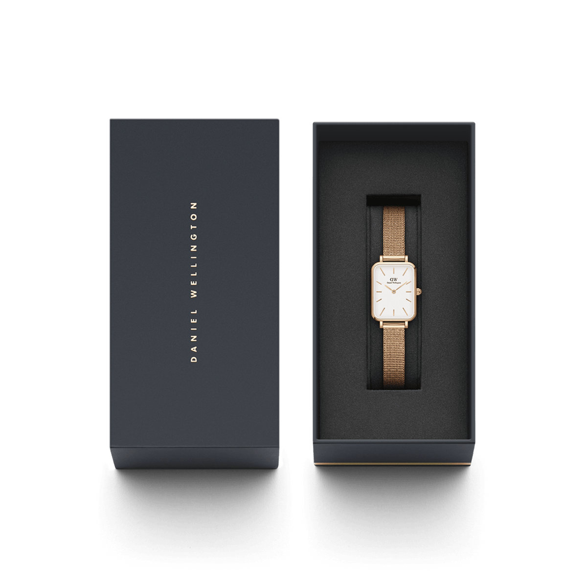Quadro Pressed Melrose watch with a rectangular eggshell white dial and rose gold mesh strap, presented in an elegant Daniel Wellington gift box.