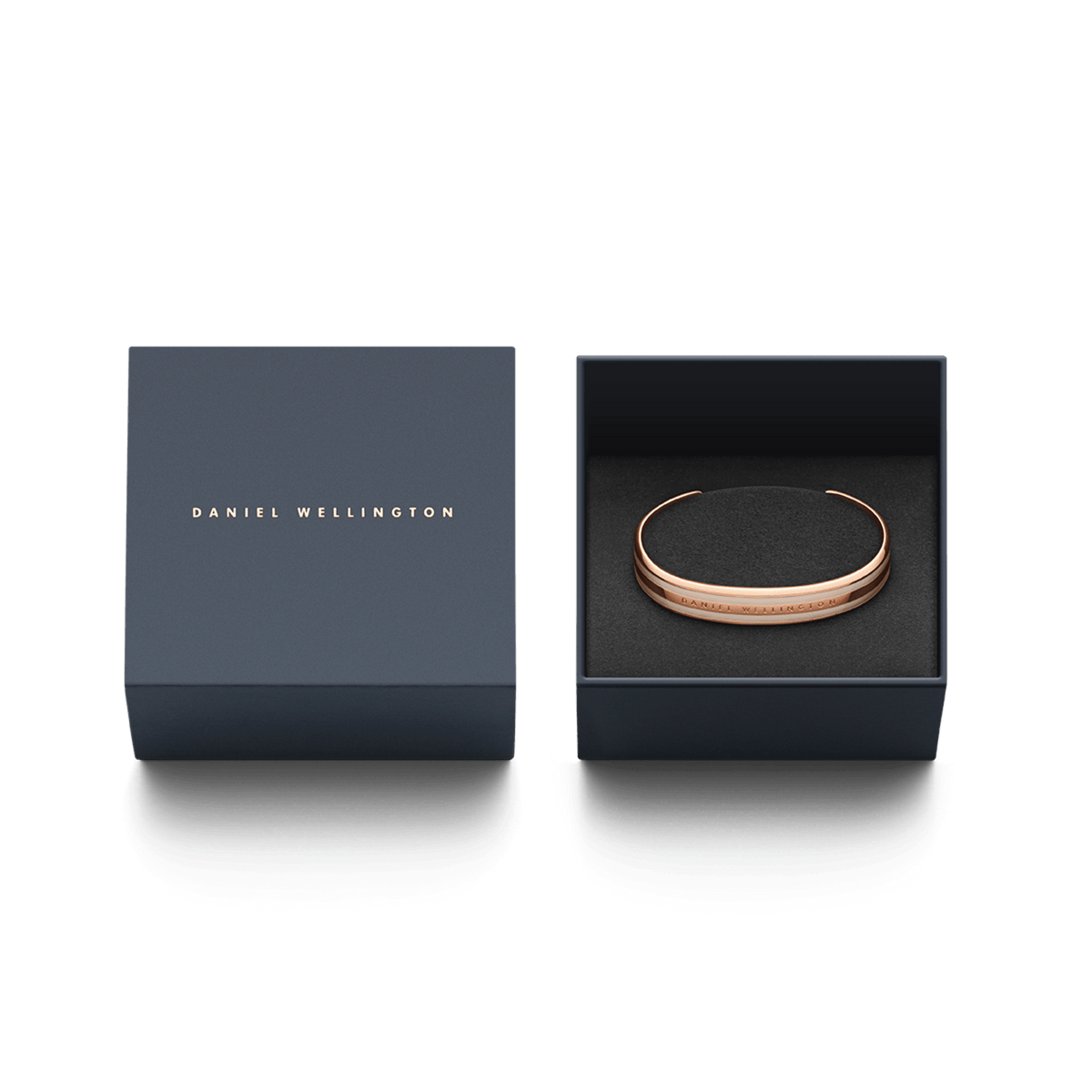 Daniel Wellington Emalie Bracelet Desert Sand Rose Gold presented in an elegant navy gift box with gold branding.