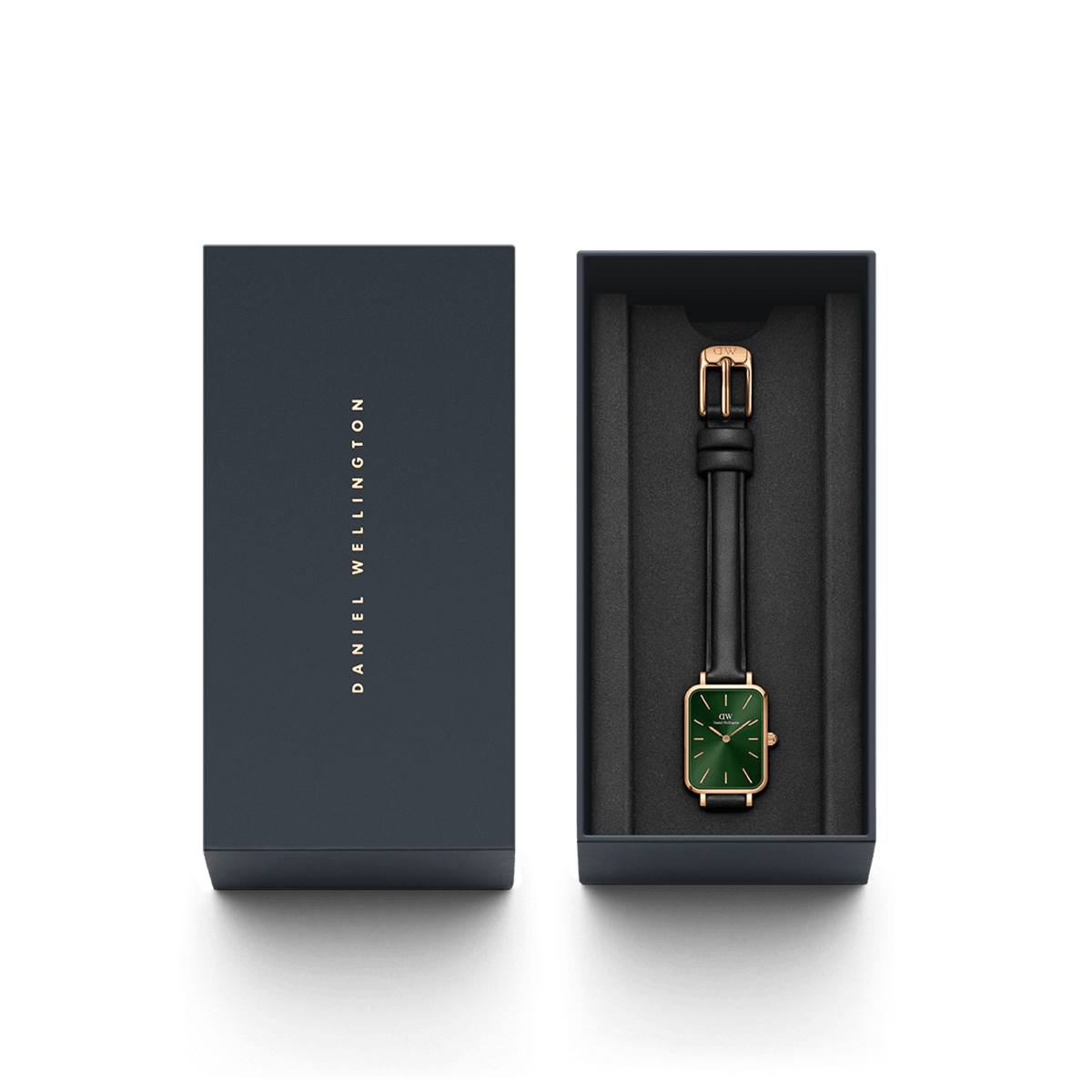 Quadro Pressed Sheffield Emerald Rose Gold watch with a green rectangular dial, rose gold case, and black leather strap presented in a sleek Daniel Wellington gift box.