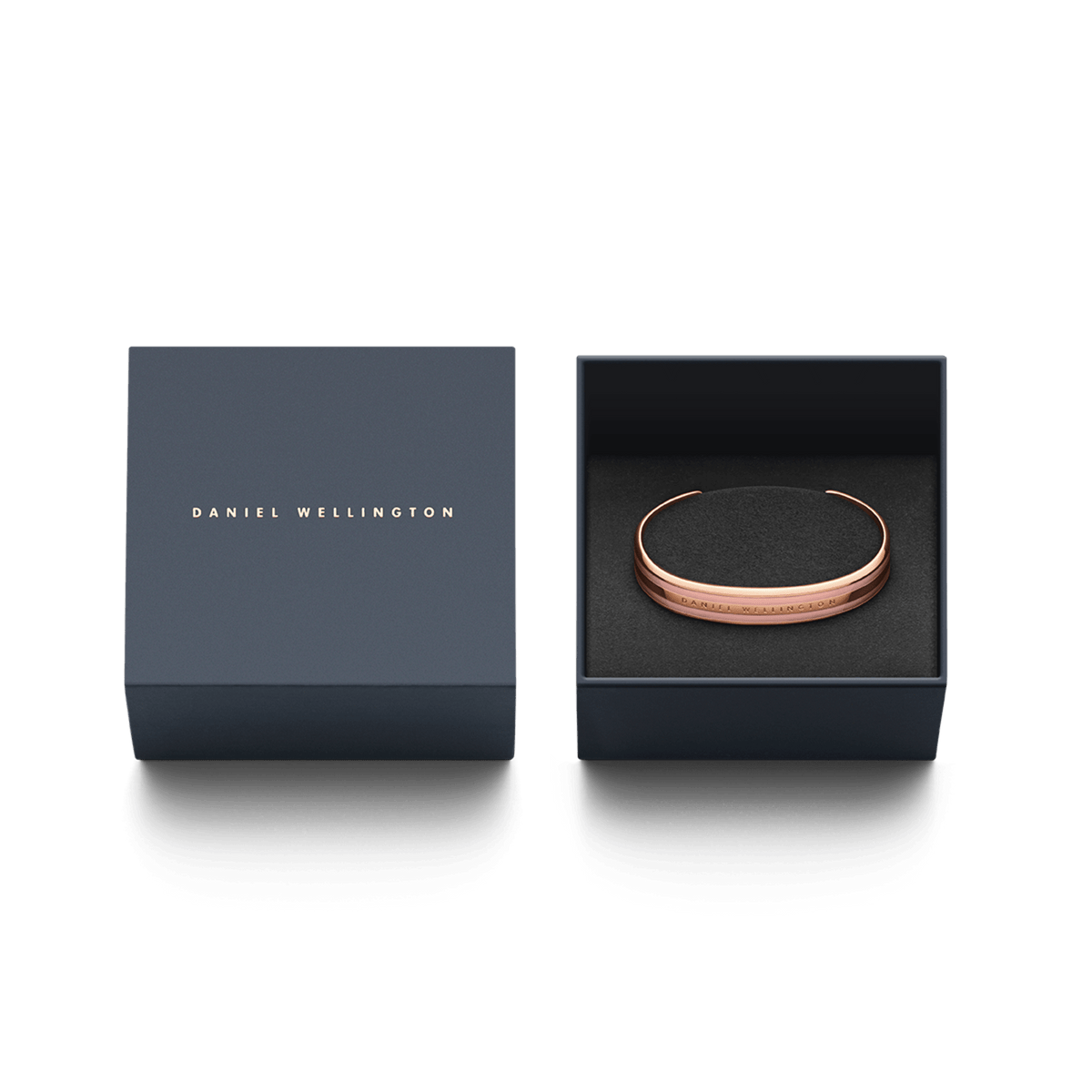 Daniel Wellington Emalie Bracelet in dusty rose and rose gold presented in an elegant navy gift box with gold lettering.