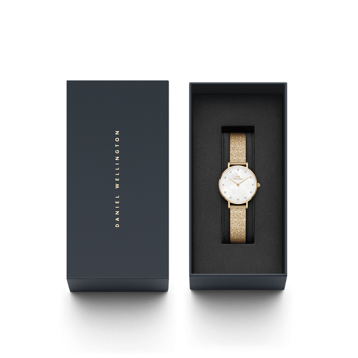 Petite Lumine Pressed Piano Gold watch with gold piano-link strap in Daniel Wellington gift box, perfect for gifting.