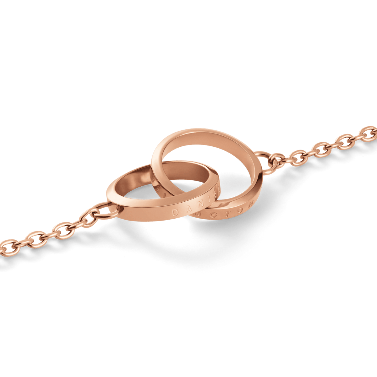 Close-up of Elan Unity Necklace in rose gold with two interlocking rings on a delicate chain, minimalist jewellery.