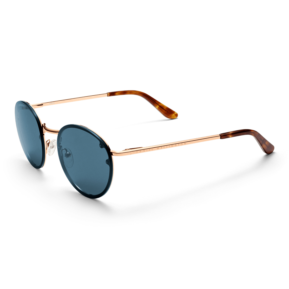 Daniel Wellington Arch Steel Blue Rose Gold sunglasses with round blue lenses, a slim rose gold frame, and tortoiseshell acetate tips.