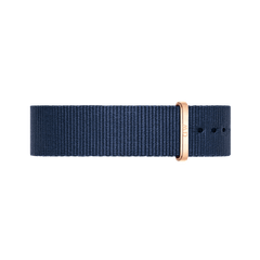 NATO-style watch strap in deep midnight blue polyester with a polished rose gold buckle and keeper, designed for Daniel Wellington watches.