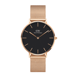 Petite Melrose women’s watch with black dial, rose gold case, and adjustable mesh strap by Daniel Wellington.